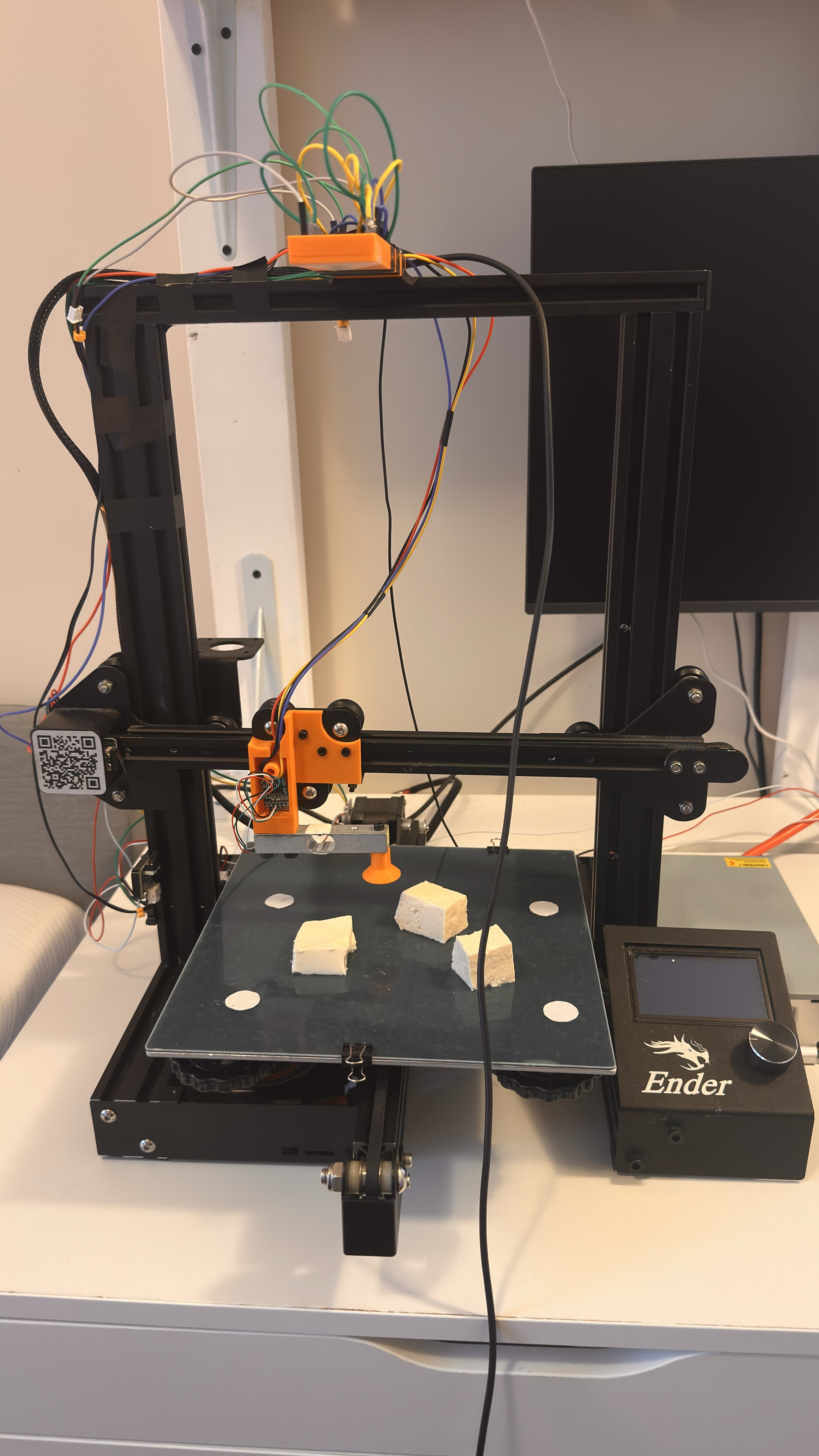 Full machine at a three-quarter angle with a tofu sample loaded on the build plate